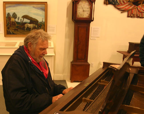 Harvey Dodd, Provincetown artist, playing piano at the Monument Lighting celebration